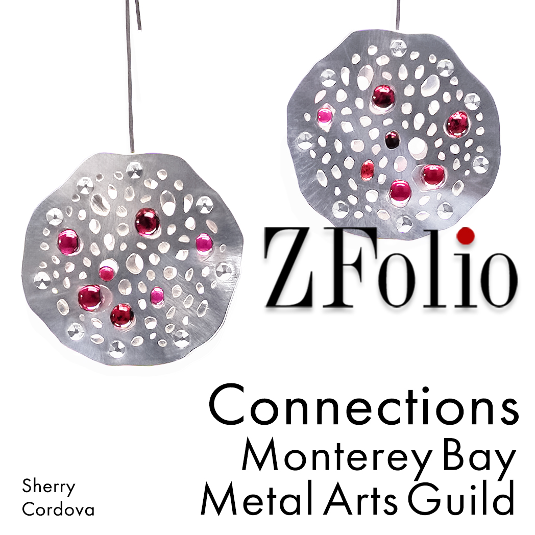 Sterling silver, low tarnish, earrings with tension set garnet spheres by Sherry Cordova Jewelry for the Connections exhibit + sale at ZFolio gallery. Monterey. Monterey Bay Metal Arts Guild.