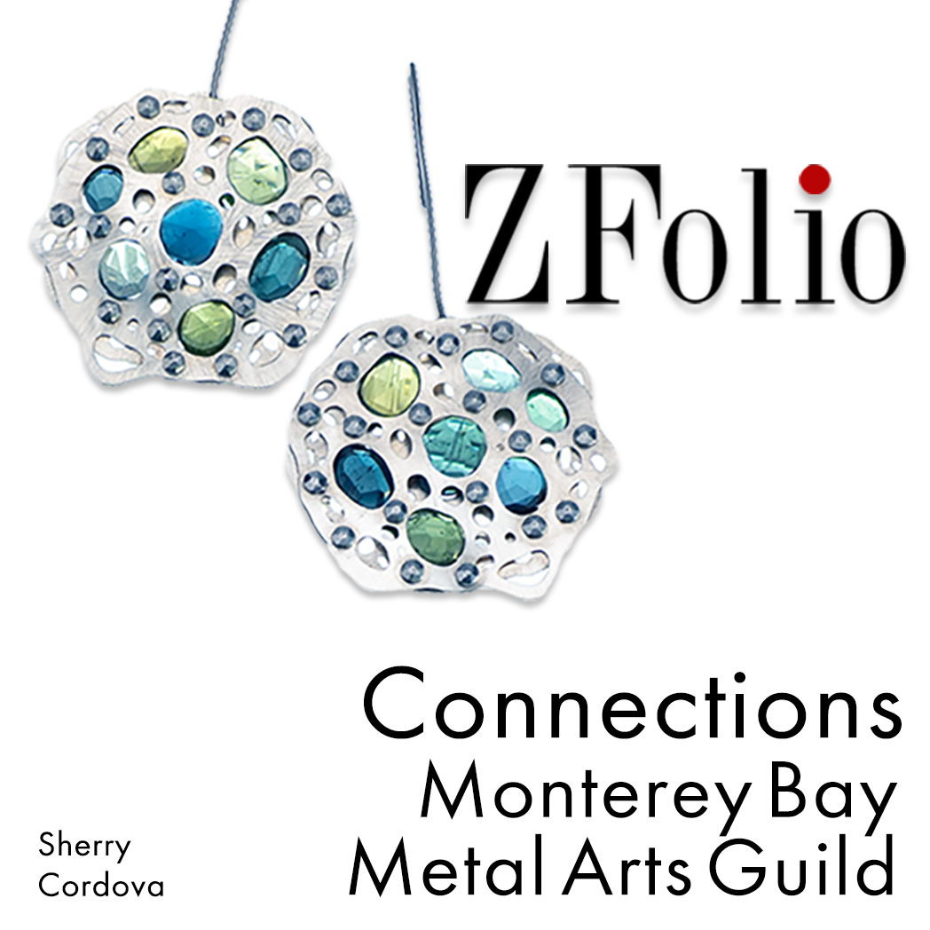 "ZFolio. Connections. Monterey Bay Metal Arts Guild. Sherry Cordova" Accompanying the text is a photo of a pair of blue and green rose cut tourmaline earrings. The tourmalines are tension set between 3 layers of low tarnish sterling silver and hung on niobium ear wires. SST fasteners help capture the stones. Created by Sherry Cordova Jewelry