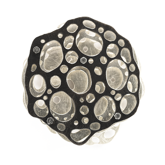 Three layer recycled sterling silver necklace based on a radiolarian drawn by Ernst Haeckel in 1862.